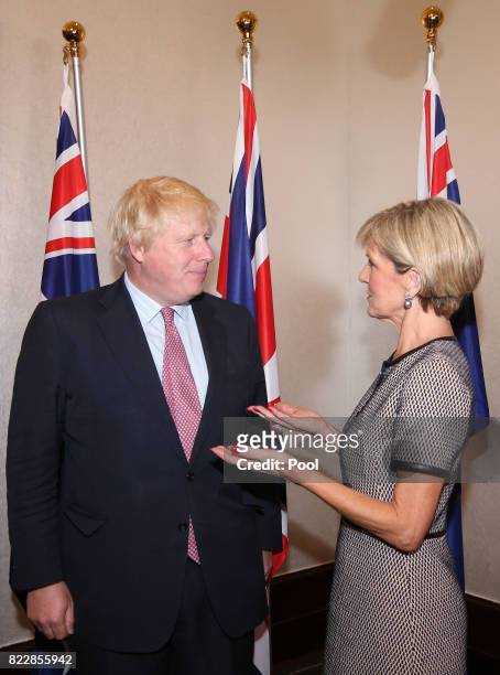 British Foreign Secretary Boris Johnson talks with Australian Foreign Minister Julie Bishop as they arrive for their bilateral meeting in Sydney,...