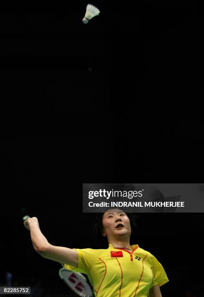 China's Lu Lan plays a shot against Malaysia's Wong Mew Choo during their women's singles quarter-final badminton match for the 2008 Beijing Olympic...
