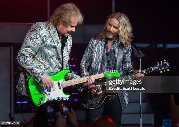 James Young and Tommy Shaw of STYX perform at DTE Energy Music Theater on July 25, 2017 in Clarkston, Michigan.