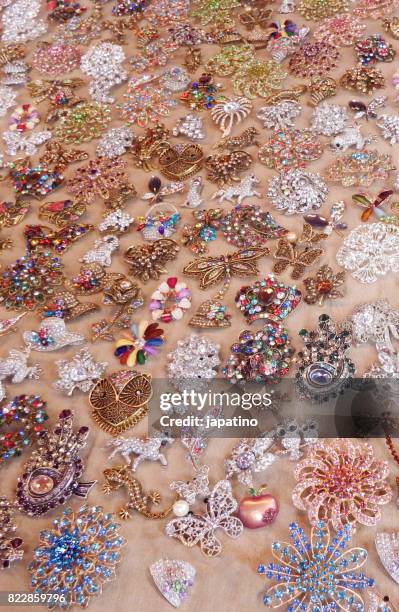 imitation jewelry on sale at street stall - bijoutier stock pictures, royalty-free photos & images