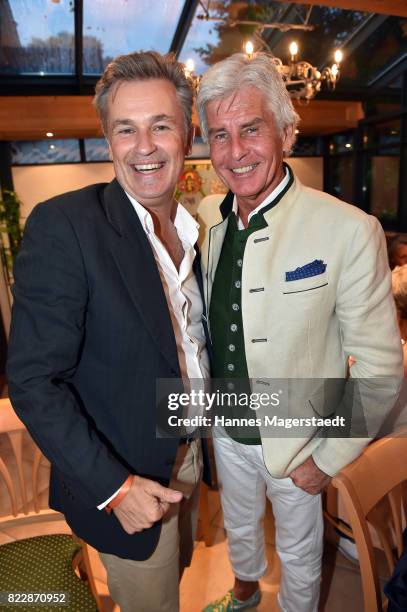 Actor Timothy Peach and Frederic Meisner during the 'La Dolce Vita Grillfest' at Gruenwalder Einkehr on July 25, 2017 in Munich, Germany.