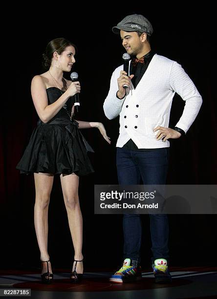 Emma Roberts and Guy Sebastian present an award during the third annual Dolly Teen Choice Awards at Luna Park on August 13, 2008 in Sydney, Australia.
