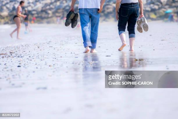 walk on the beach in summer. - ensoleillé stock pictures, royalty-free photos & images