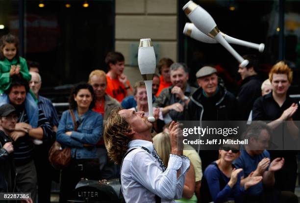 Street entertainers perform on the High Street as part of the Fringe during the Edinburgh Festival August 13 2008 in Edinburgh, Scotland. The three...