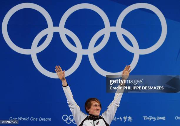 Germany's Benjamin Philip Kleibrink celebrates on the podium of the men's individual Foil tournament on August 13, 2008 at the Fencing Hall of...