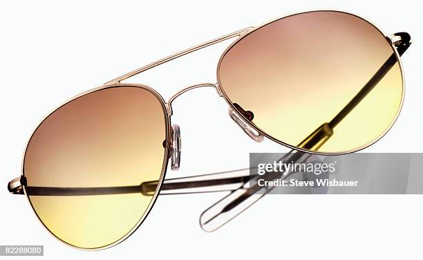 aviator style sunglasses with gol - aviator glasses fotografías e imágenes de stock