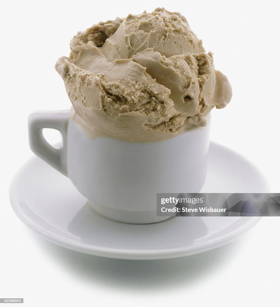 Scoop of coffee ice cream in espresso cup