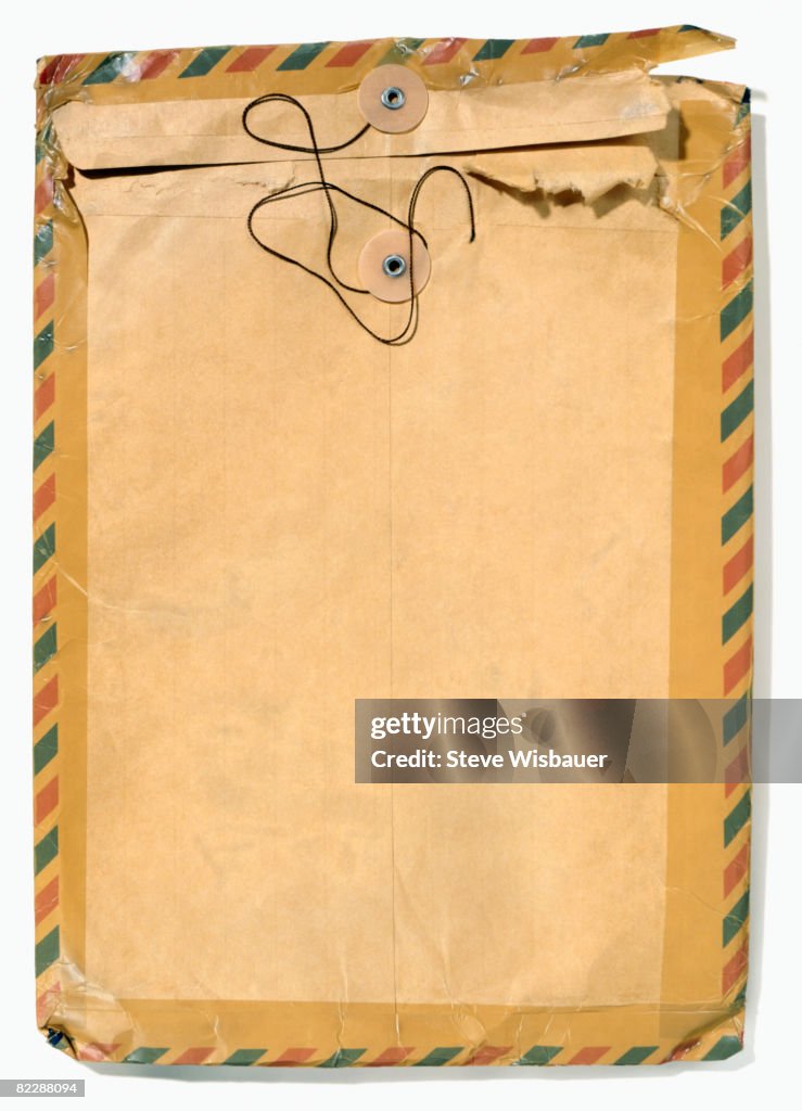 Old manila envelope with airmail tape