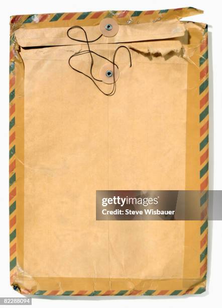 old manila envelope with airmail tape - brown envelope stock pictures, royalty-free photos & images