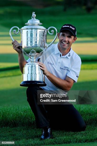 Padraig Harrington of Ireland celebrates with the PGA Championship Trophy after winning the 90th PGA Championship at Oakland Hills Country Club on...