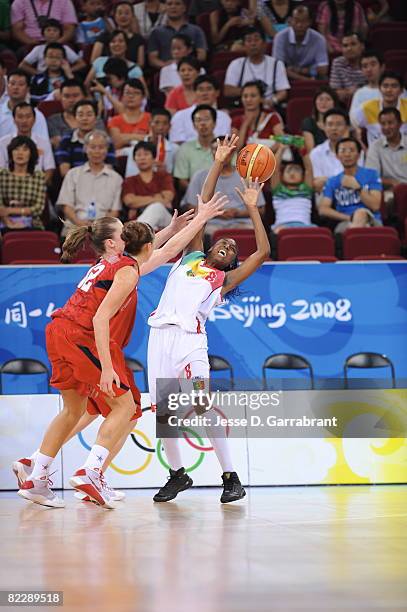 Diana Gandega of Mali goes for the looseball against Katie Smith of the U.S. Women's Senior National Team against Mali during day 3 of women's...