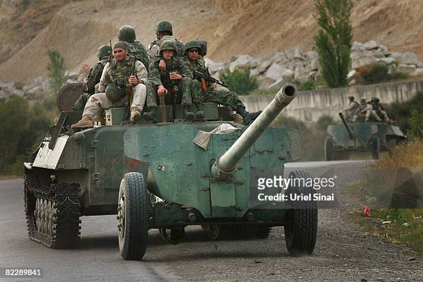 Georgian soldiers ride an armoured vehicle at a Georgian defence line on August 13 45 KM from Tbilisi, Georgia. Russia has denied reports of Russian...