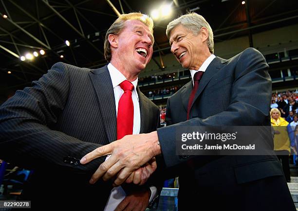 Manager of FC Twente Steve McCLaren and manager of Arsenal Arsene Wenger shake hands during the UEFA Champions League 3rd Qualifying Round, first leg...