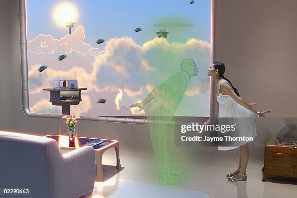 woman kissing hologram in future home - holograma imagens e fotografias de stock