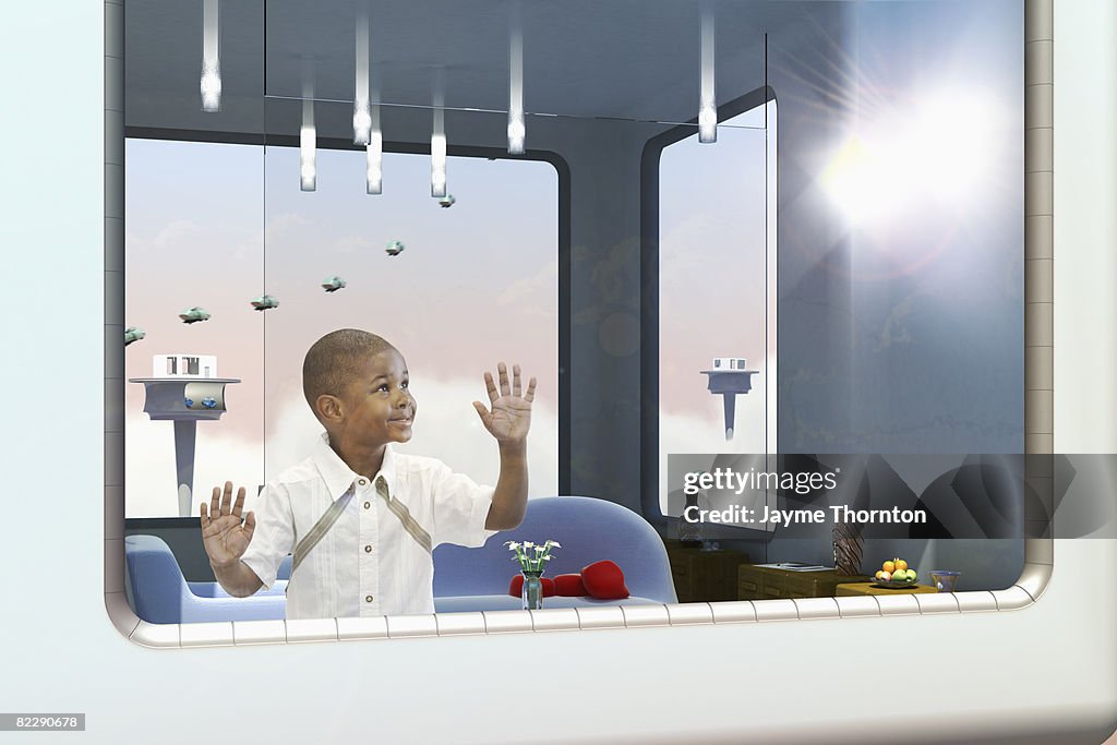 Boy looking out window of future home