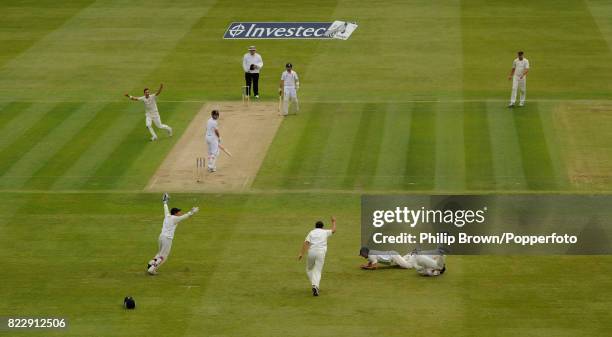 New Zealand bowler Trent Boult celebrates the wicket of England batsman Jonathan Trott, caught by Dean Brownlie for 39 during the 1st Test match...