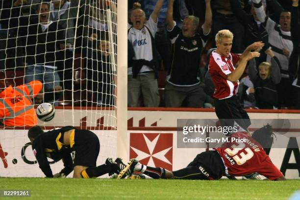 Ugo Ehiogu of Sheffield United scores an own goal during the Carling Cup 1st Round match between Sheffield United and Port Vale at Bramall Lane on...