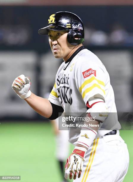 Seiichi Uchikawa pumps his fist after hitting an RBI single in the first inning of the SoftBank Hawks' 1-0 win over the Nippon Ham Fighters at...