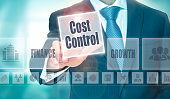 A businessman selecting a Cost Control Concept button