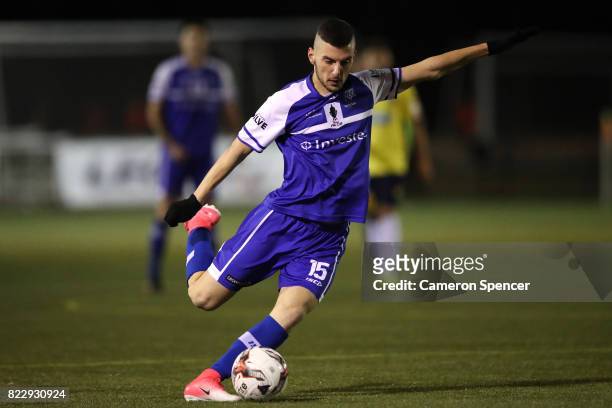Dean Bereveskos of Hakoah FC strikes the ball during the FFA Cup round of 32 match between Hills United FC and Hakoah Sydney City East at Lily's...