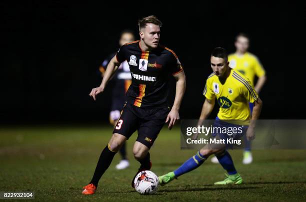 Cohan Morris of the MetroStars is challenged by Daniel Di Ruocco of the Bankstown Berries during the FFA Cup round of 32 match between Bankstown...