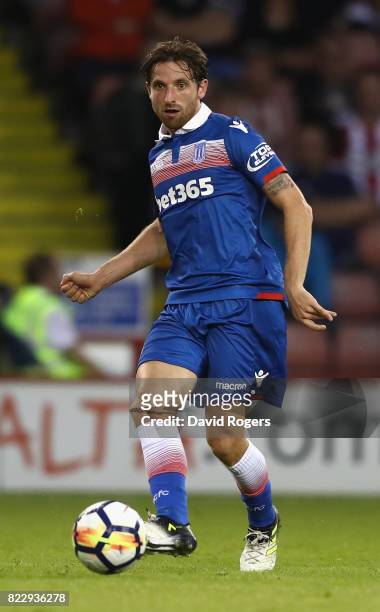 Joe Allen of Stoke City runs with the ball during the pre season friendly match between Sheffield United and Stoke City at Bramall Lane on July 25,...