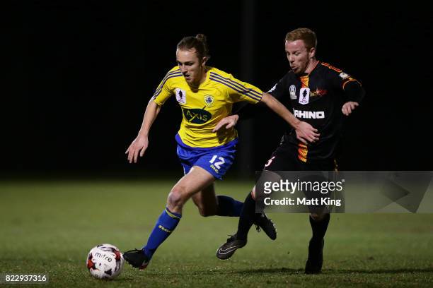 Jake Bradshaw of the Bankstown Berries is challenged by Tim Henderson of the MetroStars during the FFA Cup round of 32 match between Bankstown...