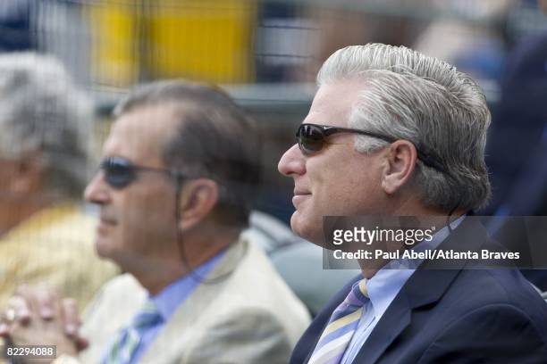 Executive Vice President & General Manager Frank Wren looks on while chairman and CEO Terry McGuirk of the Atlanta Braves speaks at a memorial...