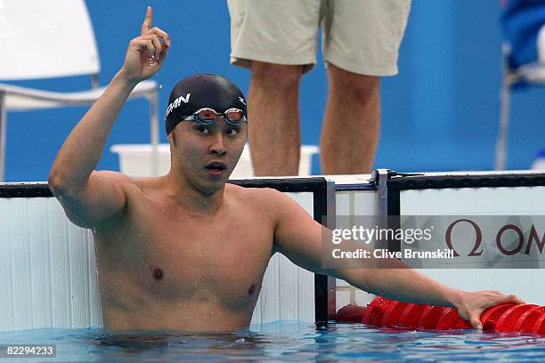 Kosuke Kitajima of Japan celebrates finishing the Men's 200m Breaststroke Final in first place and wins the gold medal at the National Aquatics...