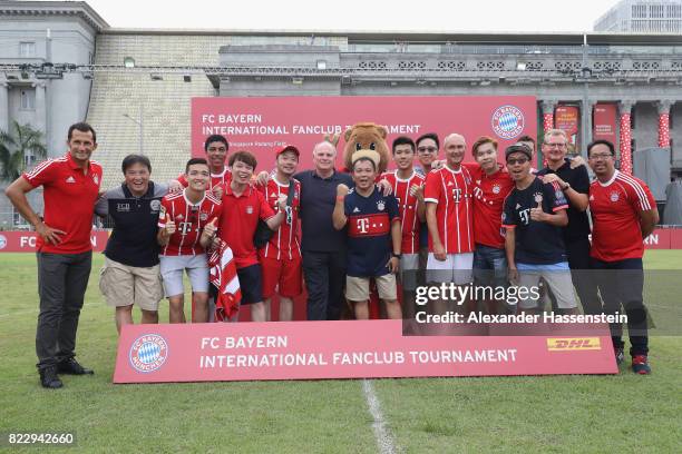 Uli Hoeness, President of FC Bayern Muenchen poses with the team of Bayern Muenchen supporters Hong Kong after the FC Bayern International Fanclub...