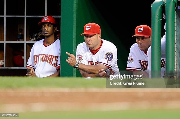 Manager Manny Acta and pitching coach Randy St. Claire of the Washington Nationals watch the game against the New York Mets August 13, 2008 at...
