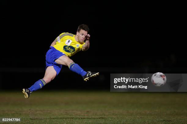 Kyle Ewart of the Bankstown Berries takes a shot on goal during the FFA Cup round of 32 match between Bankstown Berries and MetroStars SC at Jensen...