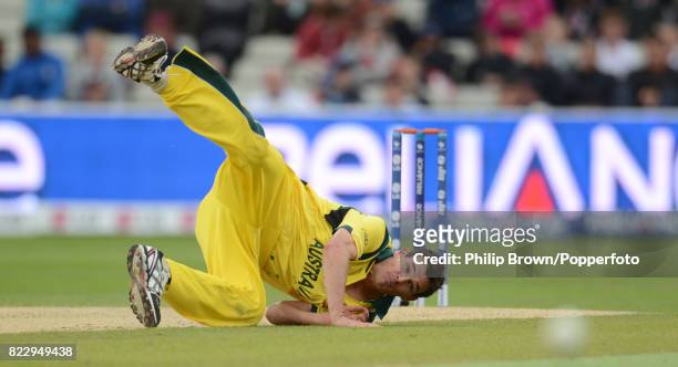 Australia bowler Clint McKay falls over in his follow through after bowling during the ICC Champions Trophy group match between Australia and New...