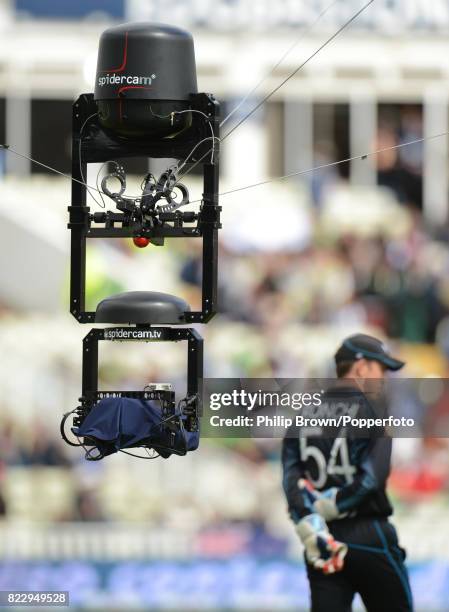 The spidercam hangs above the pitch behind New Zealand wicketkeeper Luke Ronchi during the ICC Champions Trophy group match between Australia and New...