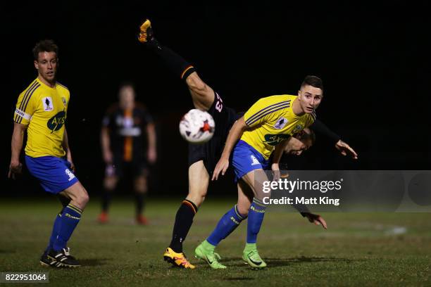 Daniel Di Ruocco of the Bankstown Berries is challenged by Christian Esposito of the MetroStars during the FFA Cup round of 32 match between...