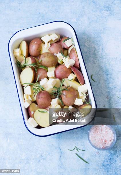 new potatoes with rosemary and butter (raw food) - fingerling potato stock pictures, royalty-free photos & images