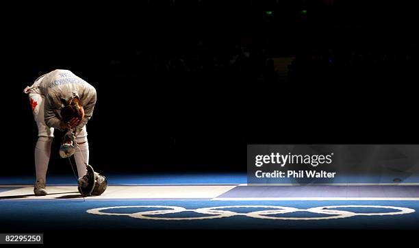 Olga Ovtchinnikova of Canada looks dejected after defeat against Aleksandra Socha of Poland in the Women's Team Sabre event at the Fencing Hall...