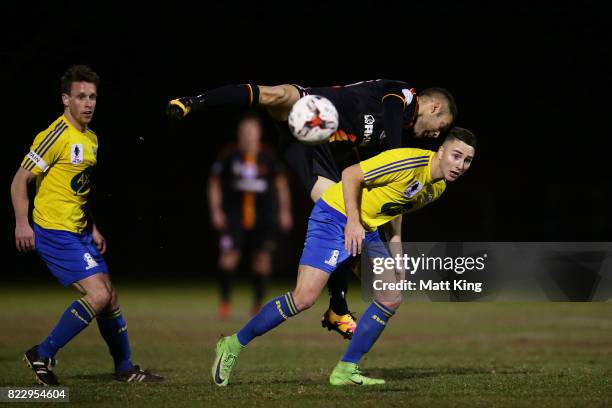 Daniel Di Ruocco of the Bankstown Berries is challenged by Christian Esposito of the MetroStars during the FFA Cup round of 32 match between...