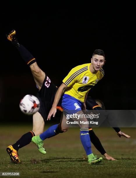 Daniel Di Ruocco of the Bankstown Berries is challenged by Christian Esposito of the MetroStars during the FFA Cup round of 32 match between...