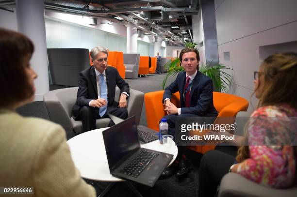British Chancellor Philip Hammond meets staff as he tours the IBM office on South Bank on July 26, 2017 in London, United Kingdom. IBM have published...