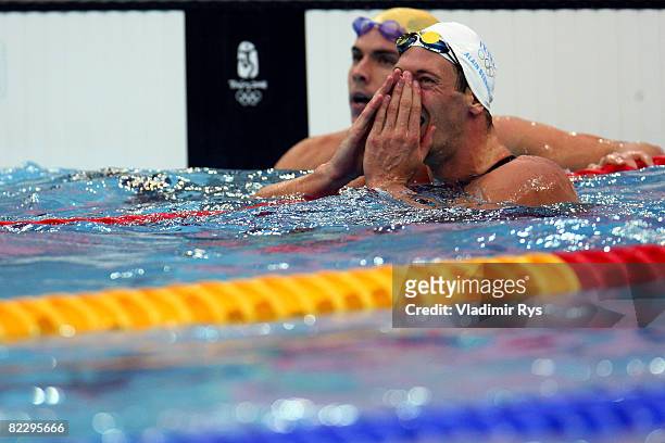 Alain Bernard of France celebrates finishing the Men's 100m Freestyle Final in first place and wins the gold medal in front of Eamon Sullivan of...
