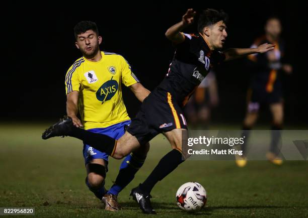 Daniel Fornito of the Bankstown Berries competes for the ball against Alex Jakob of the MetroStars during the FFA Cup round of 32 match between...