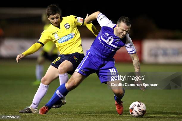 Gavin Rae of Hakoah FC and Sean Mitchell of Hills Brumbies contest the ball during the FFA Cup round of 32 match between Hills United FC and Hakoah...