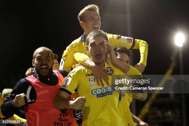 Bradley Robertson of Hills Brumbies celebrates scoring a goal with team mates during the FFA Cup round of 32 match between Hills United FC and Hakoah...