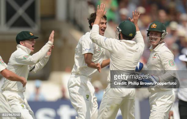 Australia's Ashton Agar celebrates with team-mates Chris Rogers, Ed Cowan and Brad Haddin after taking his first Test wicket, England captain...