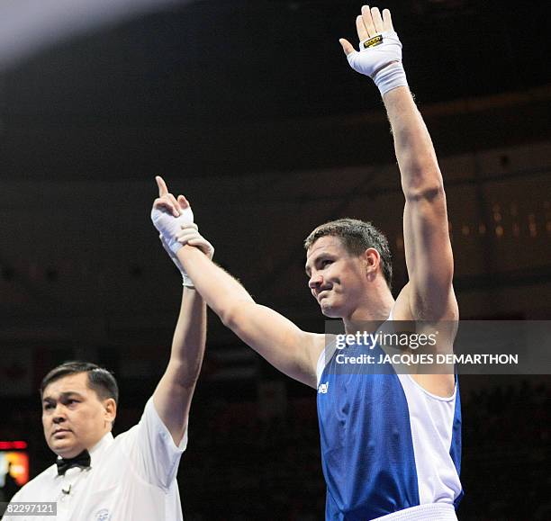 Hungary's Imre Szello is declared winner after defeating Venezuela's Luis Gonzalez during their 2008 Olympic Games Light Heavyweight boxing bout on...