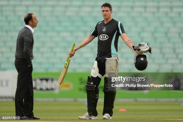 Surrey cricketer Kevin Pietersen talks with former England captain and Sky Sports commentator Nasser Hussain before the Clydesdale Bank 40 match...