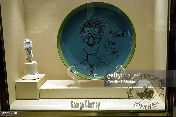 George Clooney plate to be auctioned at the carousel of Hope Ball on display at Chopard Beverly Hills