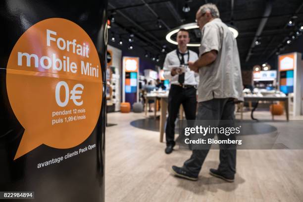 Mobile phone package advertisement sign sits inside an Orange SA store in Blagnac near Toulouse, France, on Wednesday, July 26, 2017. Orange is...