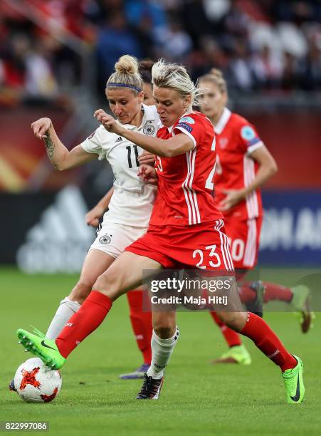 Anja Mittag of Germany and Elena Morozova of Russia battle for the ball during the Group B match between Russia and Germany during the UEFA Women's...